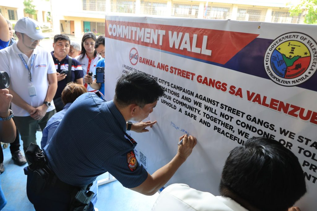 May be an image of 4 people and text that says 'LELACITY eo COMMITMENT WALL BOVERANIENT ¥ GOVERNMEN OF CITY IPLEDGE GANGS BAWAL ANG STREET GANGS 3TT4E CITY'S MIETROPOLTTAN MET OPOLITAN MANILA POUR ATIONS CAMP CAMPAIGN AIGN AGAINST UPHOLD COMMUNITY, A SAFE AND WE WILL NOT STREET SA VALENZUI GANGS. 진업원 AND TOGETHER, 嫩油! PEACEFUI WE CONDONE OR WE ST TO'