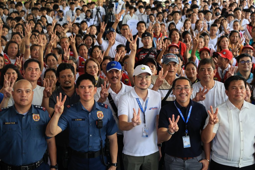 May be an image of 2 people, crowd and text