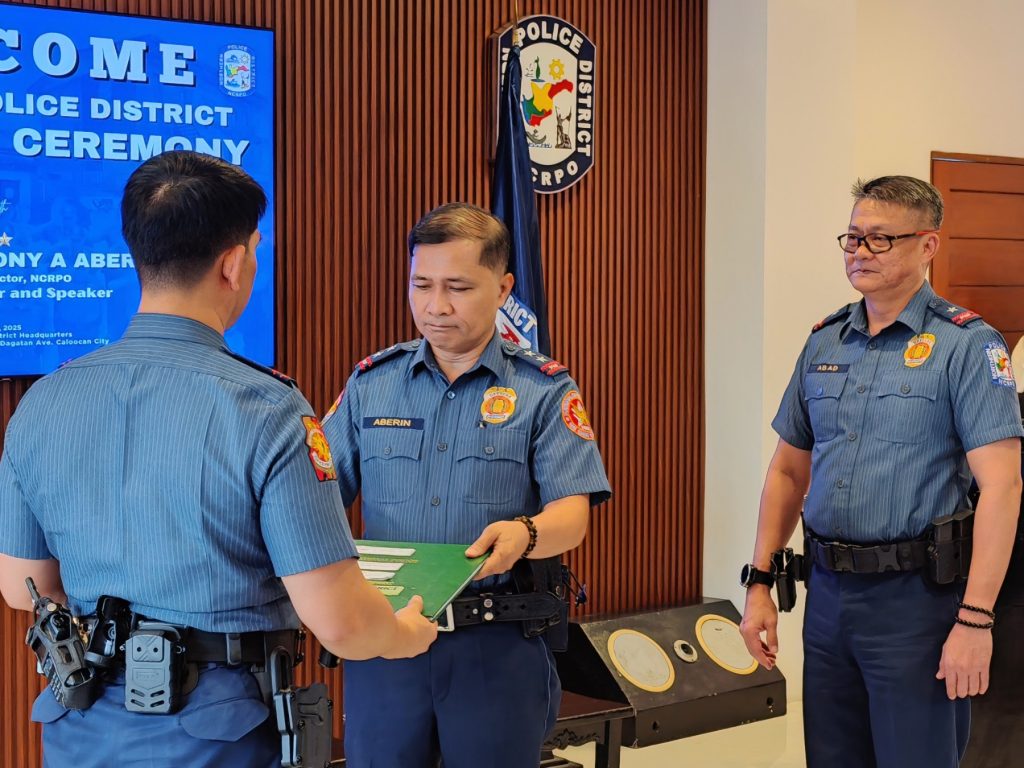 May be an image of 3 people and text that says 'O OME M LICE DISTRICT CEREMONY POLICE DISTRICT RP R NY NYAABER A ABER otor NCRPO andSpeaker and Speaker 2025 HBaиT Calosea City RICT ABERIN ABAP こニ'