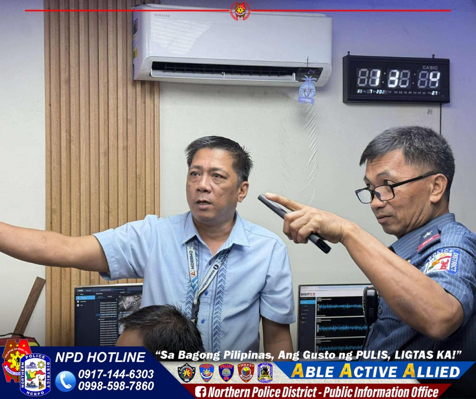 May be an image of 2 people, newsroom and text that says 'SEMSUNG NESN 88:88:88 80-11-202 21 DIGITEX POLICE NPD HOTLINE "Sa Bagong Pilipinas, Ang Gusto ng PULIS, LIGTAS KA!" 0917-144-6303 ABLE BLE A ACTIVE ALLIED 0998-598-7860 f Northern Police District- Public Information Office'