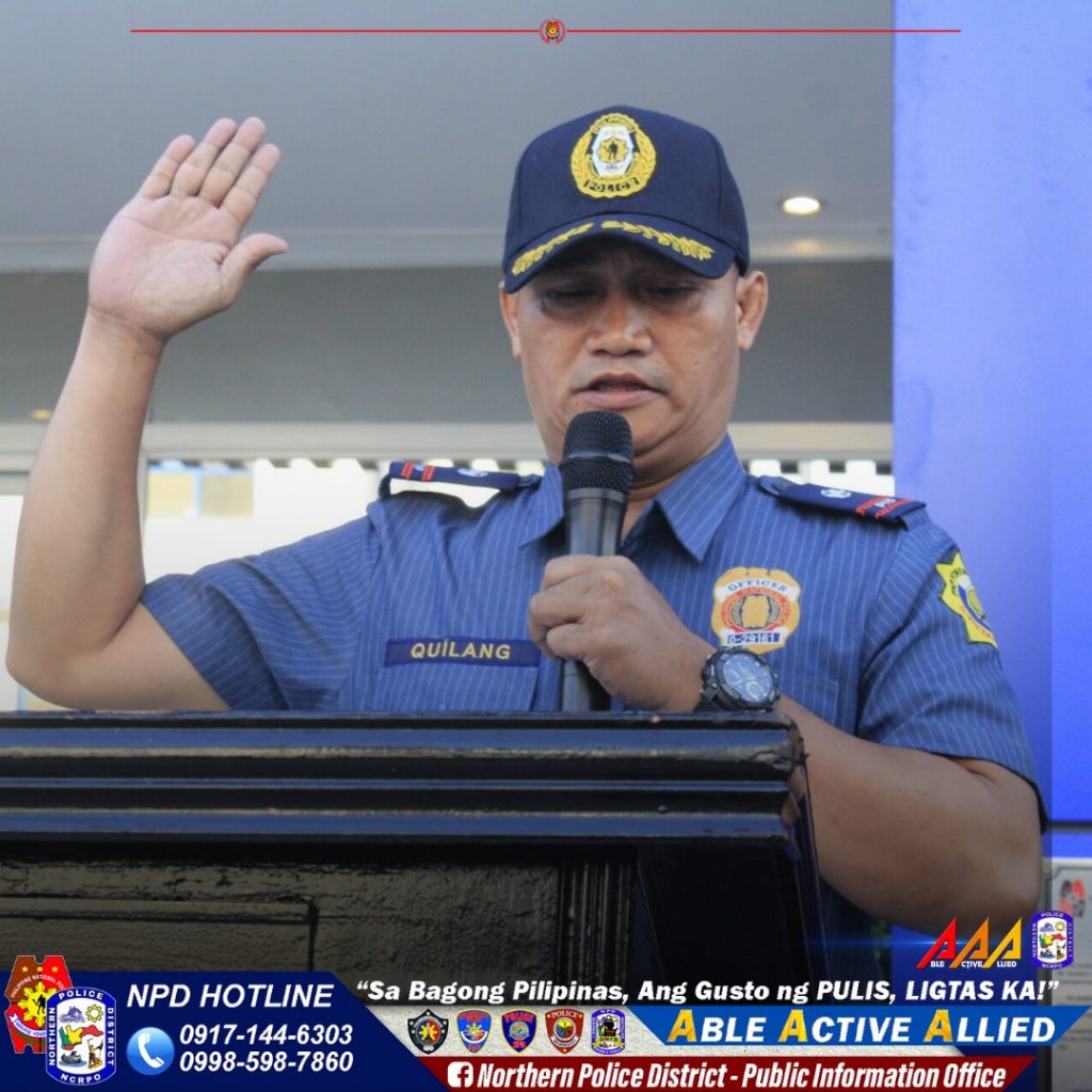 May be an image of 1 person and text that says '1294c-5 BYRISEN QUILANG QUIL ๆฐใณๅทฅใน่ถ่ป FOLIOE AAA MC NPD HOTLINE "Sa Bagong Pilipinas, Ang Gusto ng PULIS, LIGTAS KA!" 0917-144-6303 ABLE ACTIVE ALLIED A 0998-598-7860 f Northern Police District- Public Information Infor Office'