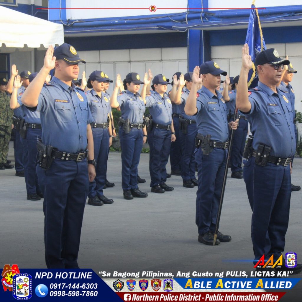 May be an image of 8 people and text that says 'ESUUnAA TO4o NPD HOTLINE 0917-144-6303 0998-598-7860 AAA "Sa Bagong Pilipinas, Ang Gusto ng PULIS, LIGTAS KA!" ABLE ACTIVE ALLIED f Northern Police District- Public Information Office'