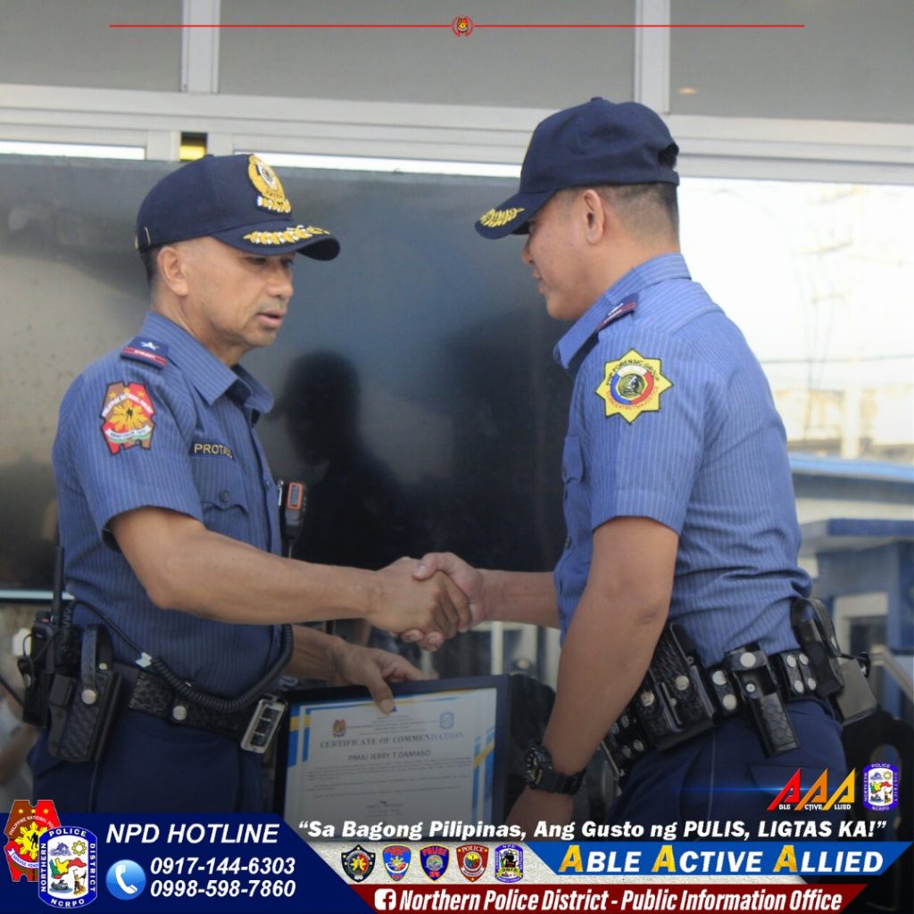 May be an image of 2 people and text that says 'PROTE TI POLIO NPD HOTLINE 0917-1 0917-144-6303 0998-598-7860 AAA "Sa Bagong Pilipinas, Ang Gusto ng PULIS, LIGTAS KA!" ABLE ACTIVE A ALLIED f Northern Police District- Public Information Infor Office'